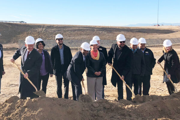 Photo of the groundbreaking ceremony for the on-ramp connecting Tower Road to westbound Peña Boulevard