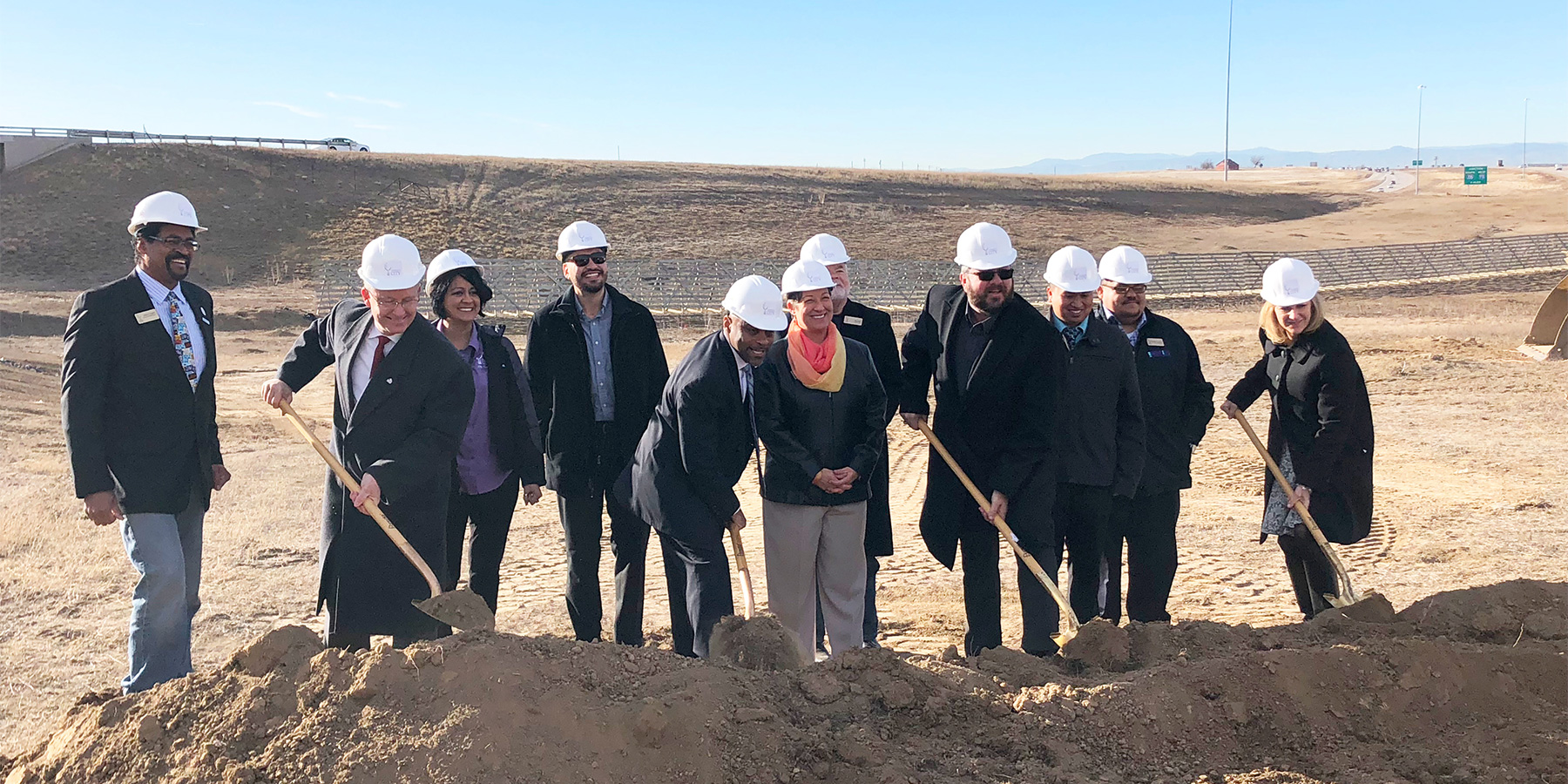 Photo of the groundbreaking ceremony for the on-ramp connecting Tower Road to westbound Peña Boulevard