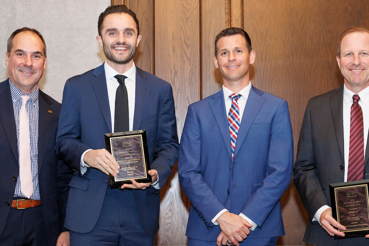 Photo of Benesch's Michael Minsky and WisDOT Program Manager Tom Buccholz with other project team members holding their awards from ACEC-WI.