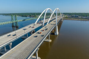 A photo from above of the two I-74 Mississippi River Bridge with car traffic