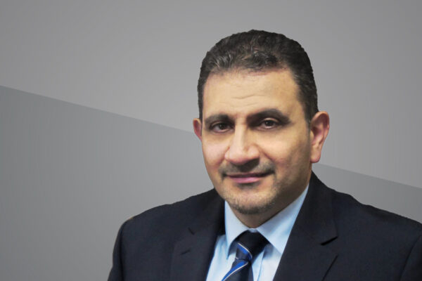 Headshot of Ihab Darwish on grey background