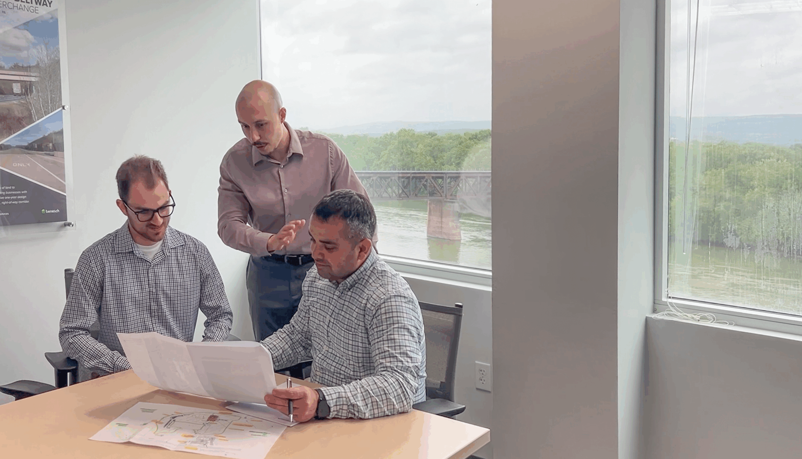 Group of employees reviewing plans