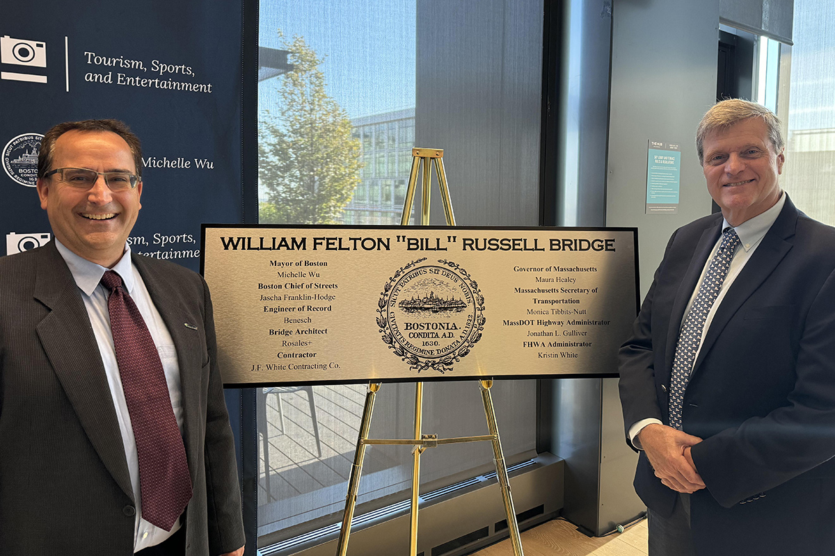 Ed Baumann and Matt Card in front of Bill Russell Dedication Plaque