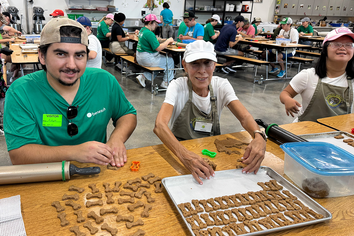 Benesch employee makes dog treats with North Florida School of Special Education students.